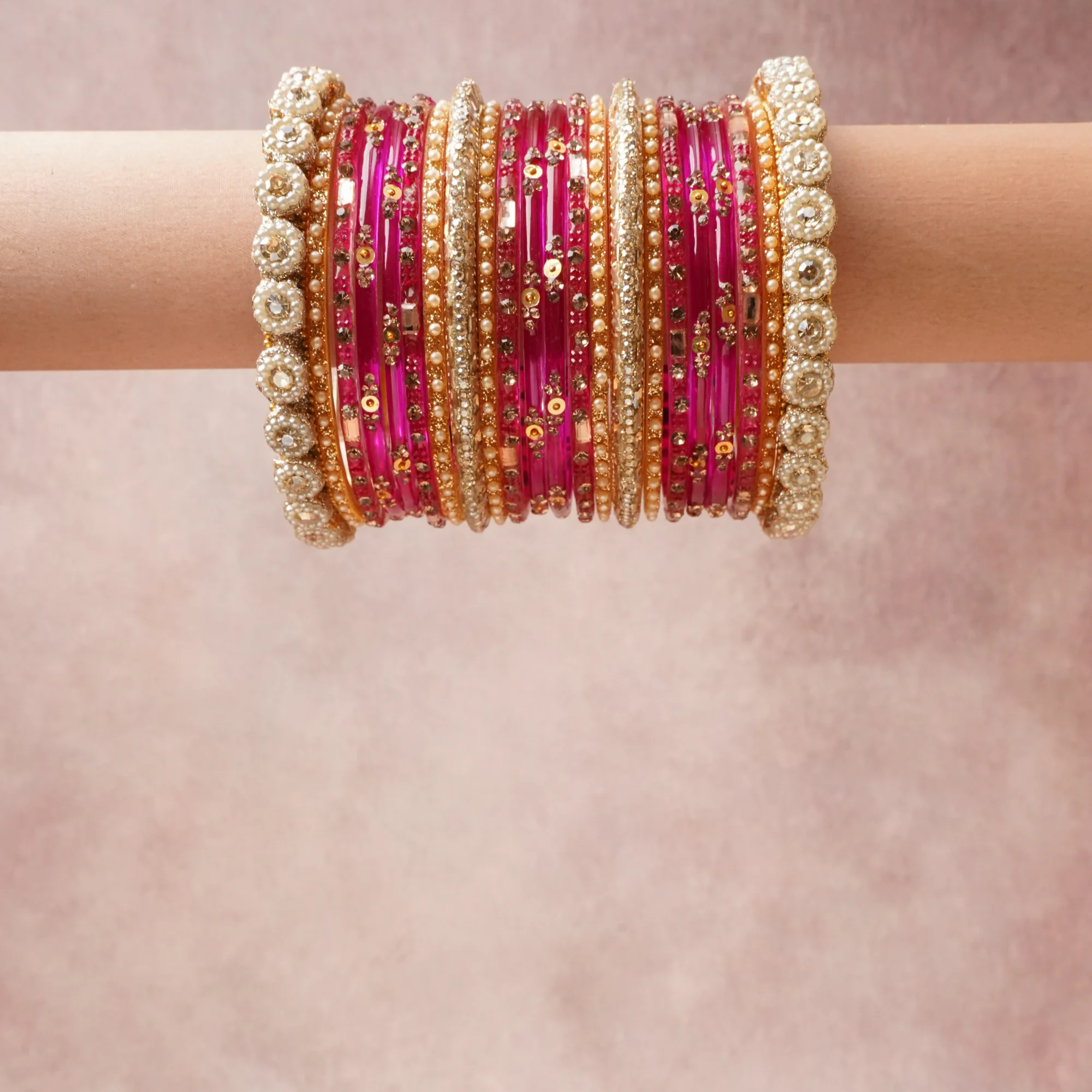A grounding Fuchsia forms the heart of the set, while touches of Clear Crystal add charm.

A thoughtful composition of Glass, Gold-toned Metal, Pearls, Crystals, Sequins, designed to feel complete without being heavy.
Each element layers seamlessly, creating a look that is refined, wearable and quietly striking.